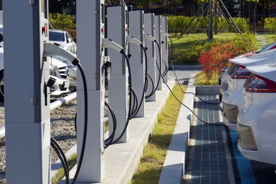 Electric vehicle charging station with white cars plugged in